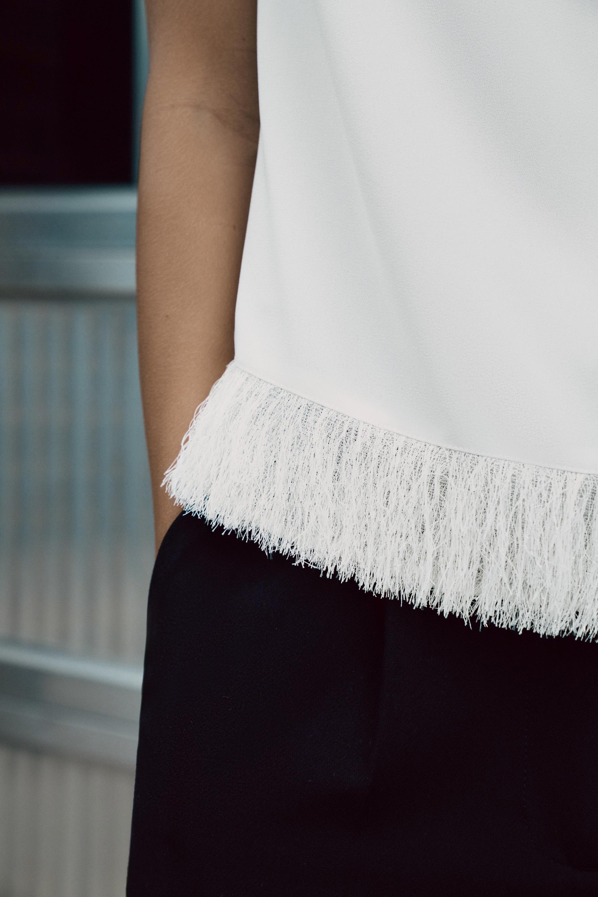 SHOULDER PAD FRINGED TOP